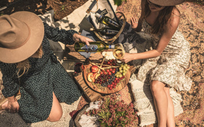 Women sharing a picnic and glass of Ivanhoe Chardonnay